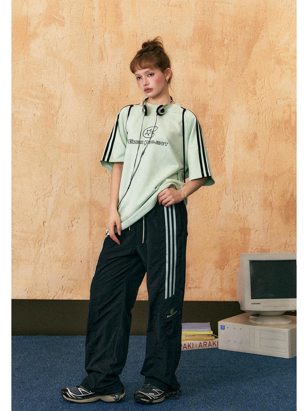 Ezek Free Project Sporty Two-piece Set - Graphic T-shirt and Wide-leg Track Pants