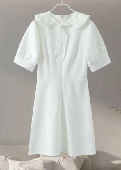 Amelie - Pearl Button Mini Dress
