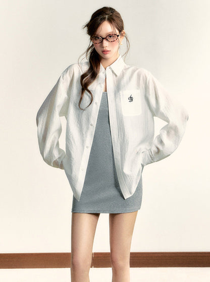 Classic White Long Sleeve Button-down Shirt: Crisp Cotton Collared Blouse With Embroidered Logo